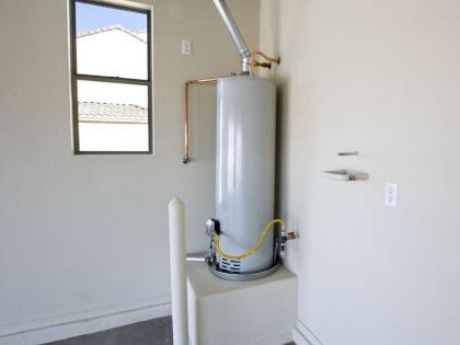 Water heater in a corner.